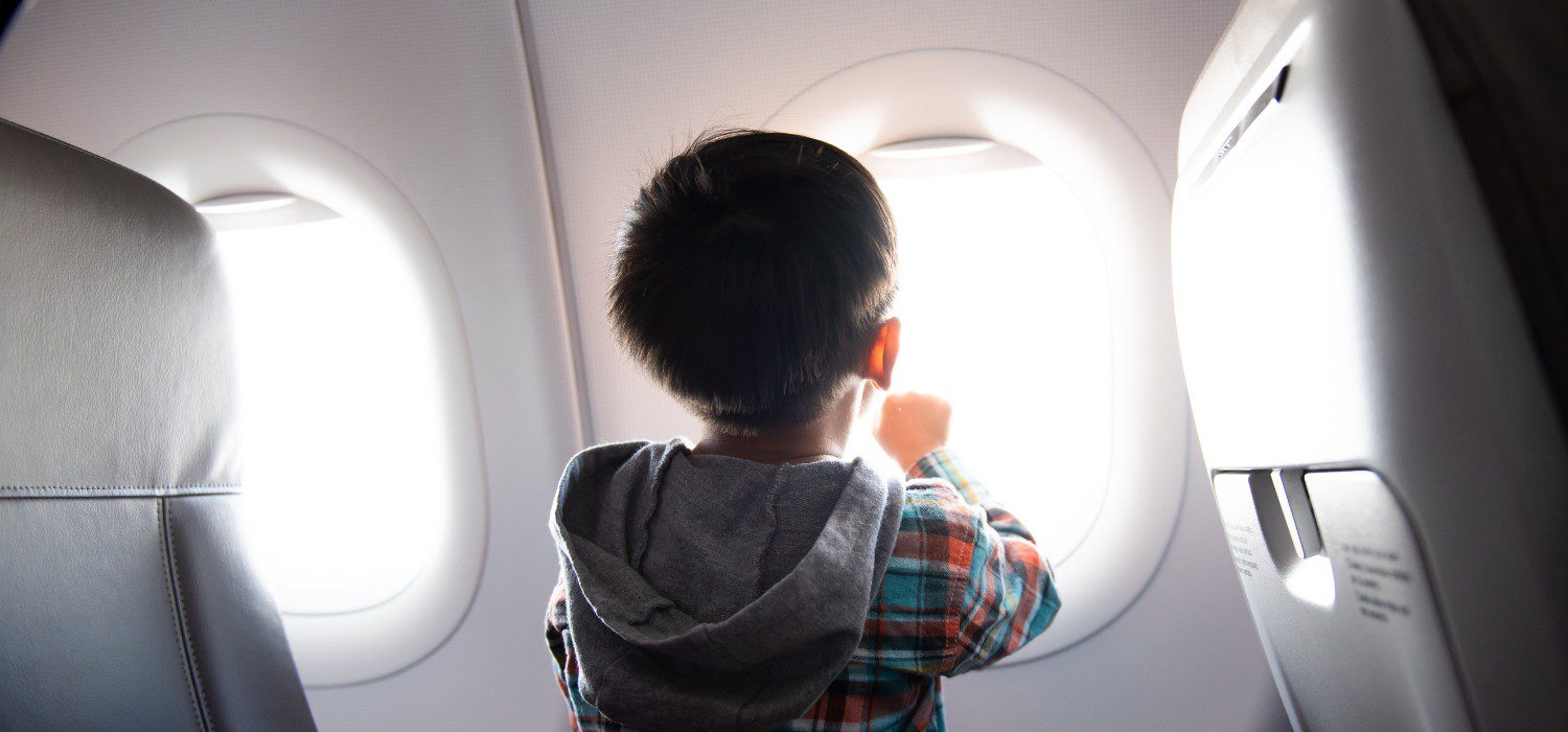 From 18 months to big kids – how to keep it together on a plane (expert tips, top gear & travel checklist)